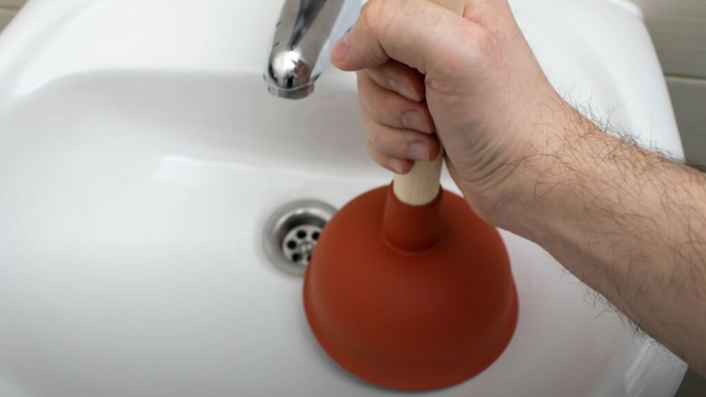 plunger against clogs